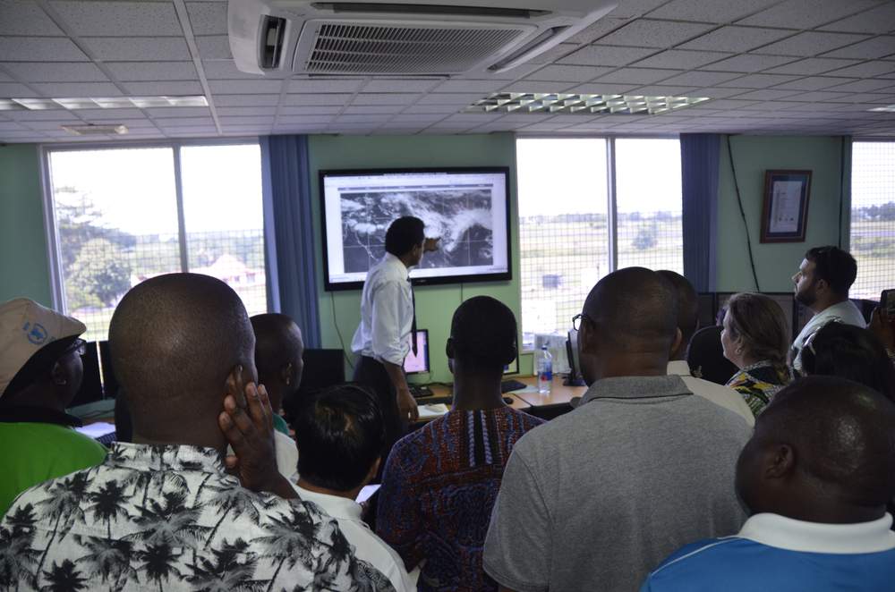 Meteorologists discuss an upcoming tropical disturbance with international representatives at the Fiji Meteorological Services in Nadi, Fiji. 