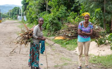 A pair of Ari women each carry a load of firewood in a village near Jinka in the Omo Valley.