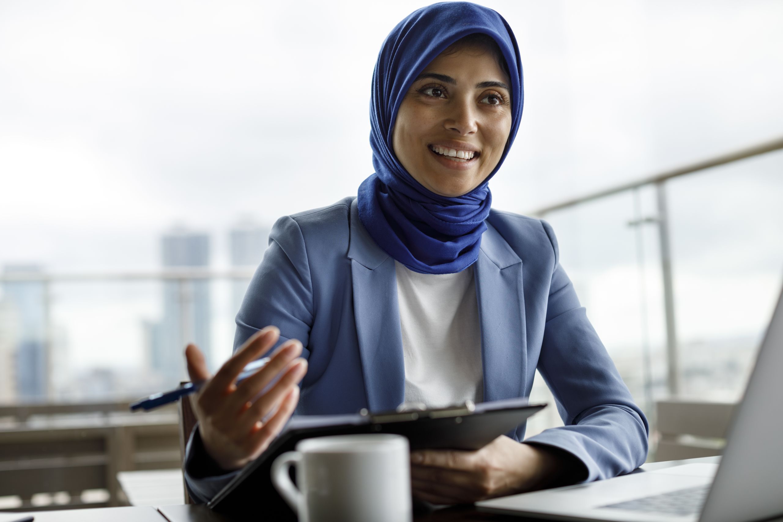 Business meeting. Woman with hijab.