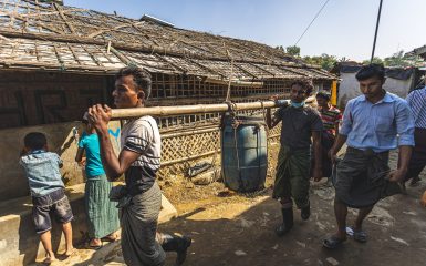 Rohingya Refugee Camp 11 (Block A, C, F, G, D) : Two rohingya men carrying drinking water to their shelter