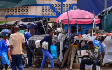 Manzini, Swaziland - 10/30/2019: Colorful market where local people and tourists buy crafts and souvenirs, household items, fruits and vegetables, traditional Swazi medicine. Eswatini, Africa