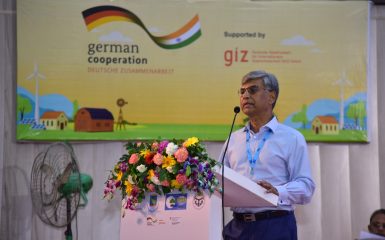 Speakers on the stage of the Conference of Panchayats