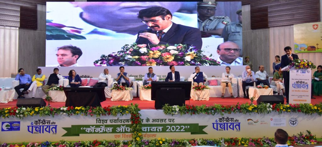 Speakers on the stage of the Conference of Panchayats 